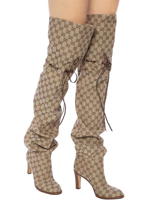 thigh high gucci boots.